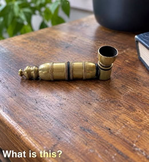 The Small Brass Object on the Table: What Is It? image