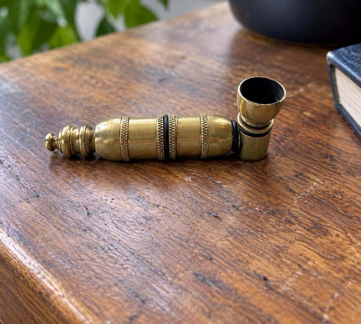 What Is This Small Antique Brass Object? image